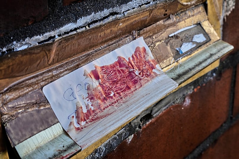 A blood covered mailbox is pictured at the entrance of a house in Hanau, 6 November, 2025