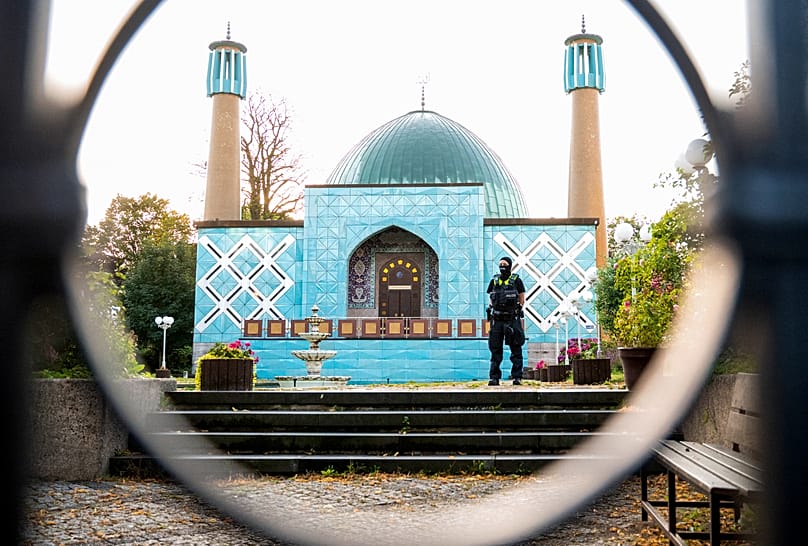 A police officer stands outside the Islamic Centre Hamburg, 24 July, 2024