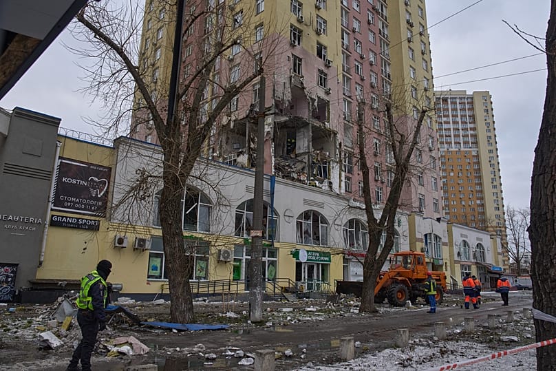 Rescuers work on the scene of a multi-storey apartment building damaged during a Russian massive missile and drone attack in Kyiv, Ukraine, Saturday, Dec. 27, 2025.