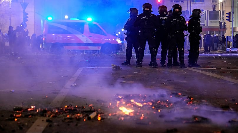 Police officers after the New Year's fireworks in Berlin on 1 January 2025
