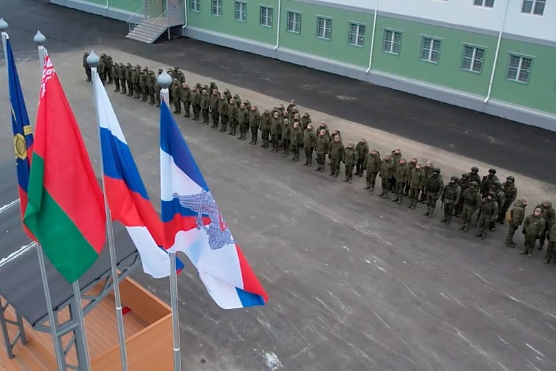 Russian troops line up at a base in Belarus where the Oreshnik missile system was deployed in Belarus.