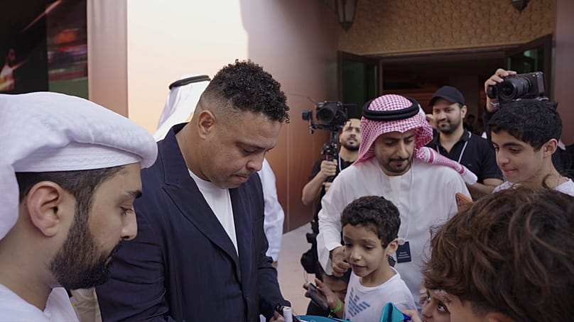 Brazil's legendary striker Ronaldo signs footballs for summit's visitors, Dubai, 29 December 2025