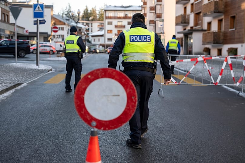 Police officers inspect the area where a fire broke out at the Le Constellation bar and lounge, in Crans-Montana, Swiss Alps, 1 January 2025