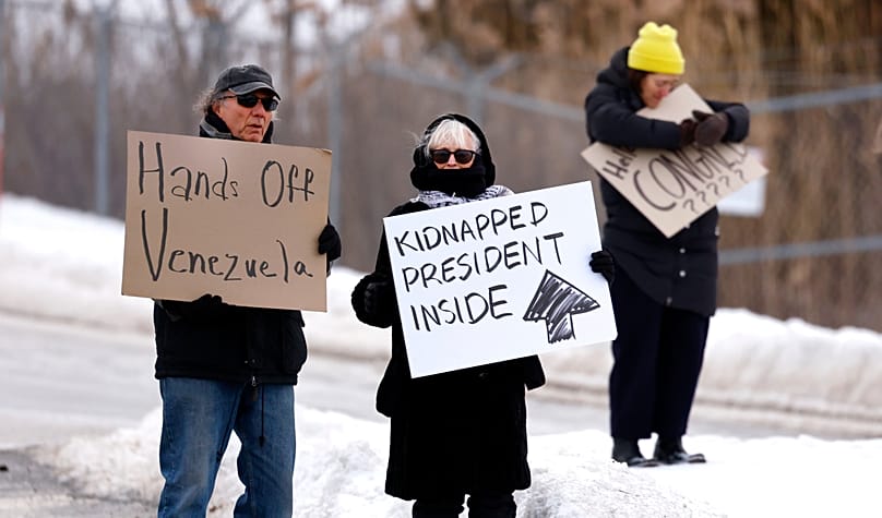 Protesters demonstrate in front of Stewart Air National Guard Base before the arrival of captured Venezuelan President Nicolas Maduro, in Newburgh, N.Y.