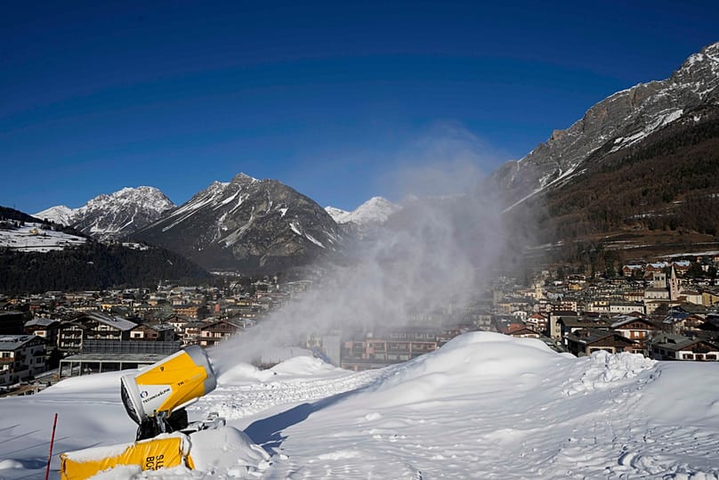 A cannon shoots artificial snow in Bormio, Lombardy