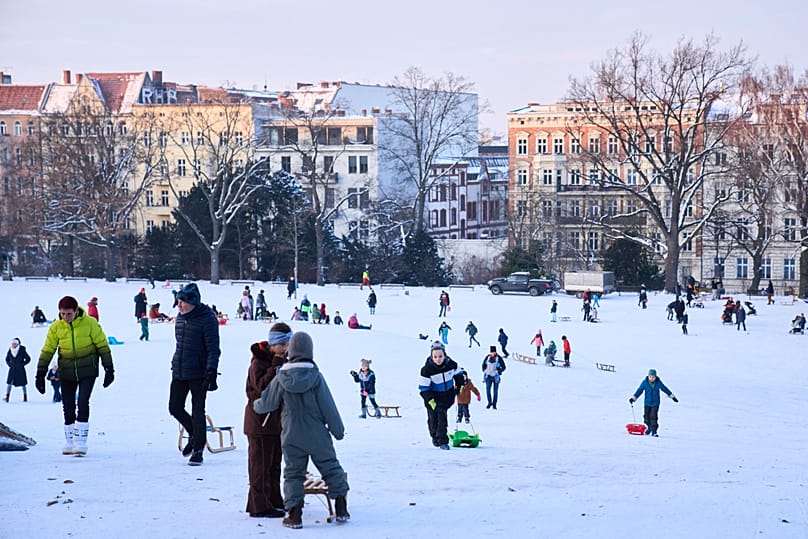 People enjoy snowfall in Berlin as winter weather covers the city, 6 January, 2026