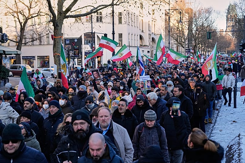 Protesters participate in a demonstration in Berlin, Germany, in support of the nationwide mass protests in Iran against the government, Saturday, Jan. 10, 2026