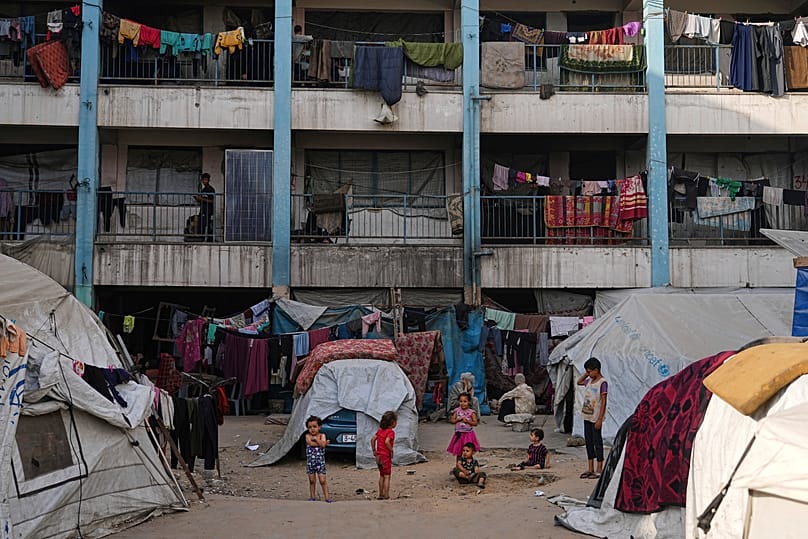 Displaced Palestinians live in a school run by UNRWA in Gaza City, 23 June, 2025