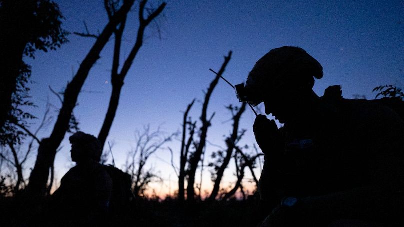 Ukraine 3rd Assault Brigade sergeant "Fedya" talks on the radio at the frontline a few kilometers from Andriivka, Donetsk region, Ukraine, Saturday, Sept. 16, 2023