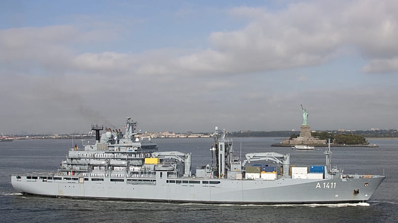The Einsatzgruppenversorger "Berlin" in front of the Statue of Liberty