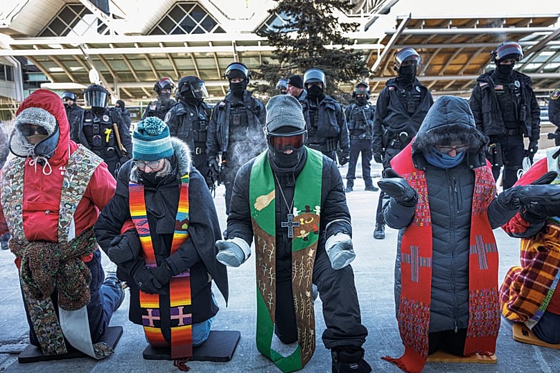 Clergy members and community activists gather at the Minneapolis-St. Paul International Airport, to protest deportation flights on Friday, 23 Jan 2026.