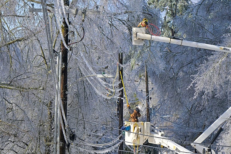 A lineman works to restore power in Oxford, Miss. on Monday, Jan. 26, 2026, following a weekend ice storm.