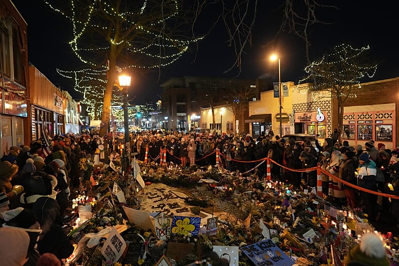People gather during a vigil where Alex Pretti was shot and killed by federal immigration enforcement on Wednesday, Jan. 28, 2026.