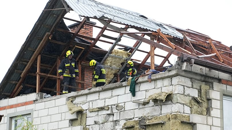 Firefighters on a destroyed roof after being hit by Russian drones, Wyryki near Lublin, Poland, 11 September 2025
