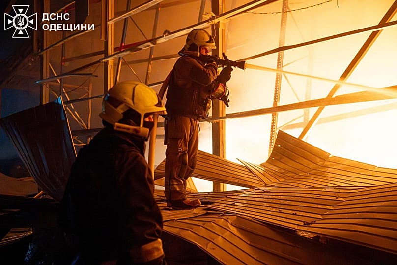 Emergency services personnel work to extinguish a fire following a Russian attack in Odesa region, 29 January, 2026