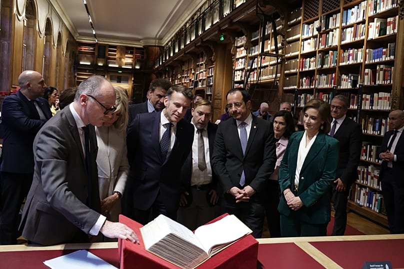 Close inspection: Emmanuel Macron and Nicos Christodoulides, the presidents of France and Cyprus with the wives at the National Library of France