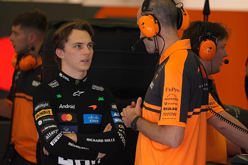 McLaren driver Oscar Piastri speaks with his team during a F1 pre-season test in Sakhir, Bahrain, 2026.
