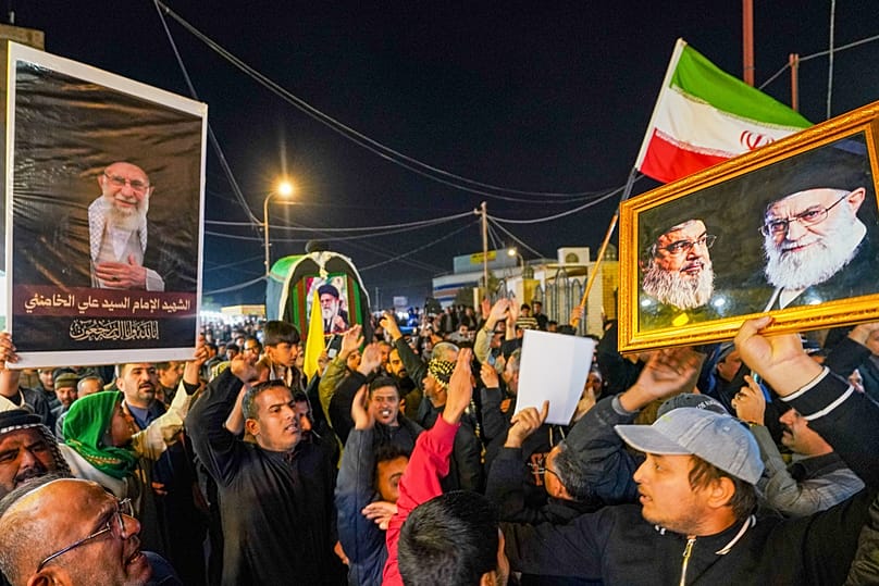 4 March: Iraqi Shiites carry a replica of the coffin of the Supreme Leader Ayatollah during a funeral service in Najaf, Iraq.