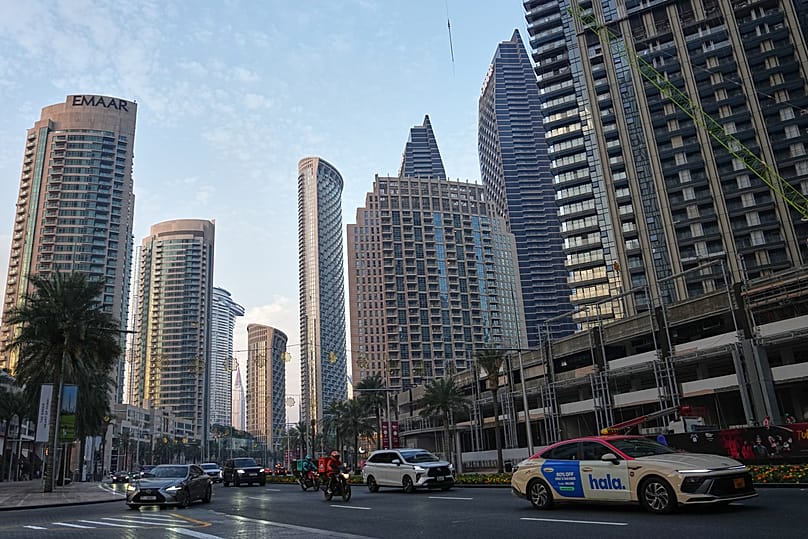 Light traffic moves along a main road in downtown Dubai, 7 March, 2026