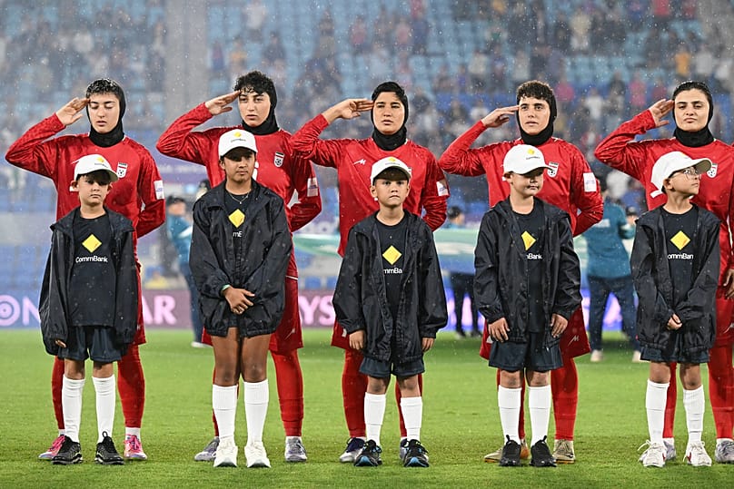 Iranian players salute ahead of the Women's Asian Cup soccer match between Iran and the Philippines in Robina, 8 March, 2026