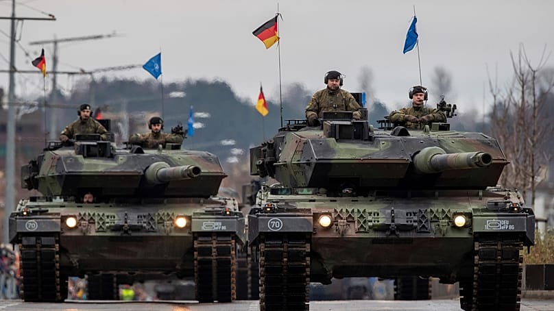 German soldiers with Leopard 2A6 main battle tanks at the Armed Forces Day military parade in Vilnius, 25 November 2023