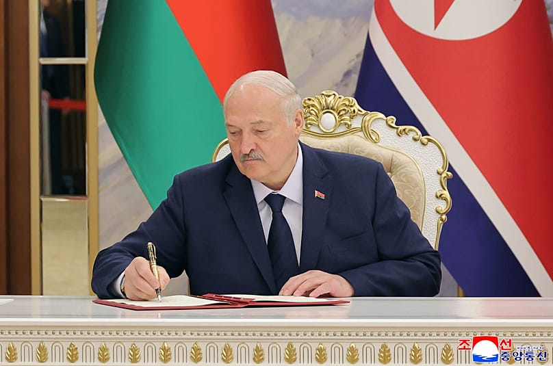 Belarus’ President Aliaksandr Lukashenka signs a document in Pyongyang, 26 March, 2026