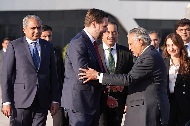 Vice President JD Vance shakes hands with Pakistani Foreign Minister Mohammad Ishaq Dar, as he prepares to board Air Force Two after attending talks on Iran in Islamabad.