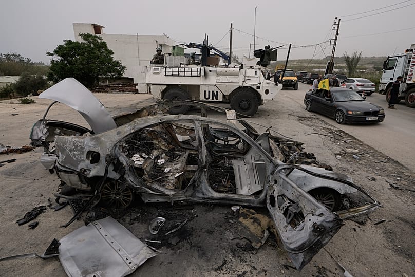 French UN peacekeepers stand on their armoured personnel carrier in Qasmiyeh, 18 April, 2026