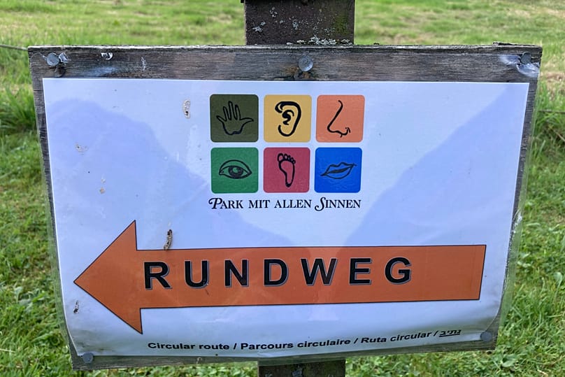 A sign at the Park for All Senses, known locally as Park Mit Allen Sinnen, is displayed, Thursday, Aug. 8, 2024, in Gutach, Germany.