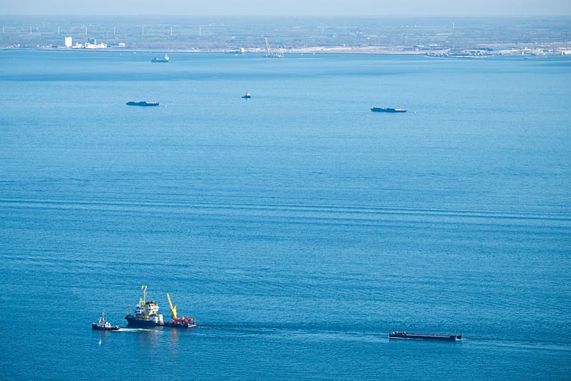 The humpback whale recovered from a shallow bay off Wismar is being transported towards the North Sea by two tugboats in a flooded cargo ship off the Danish coast, in Fehmarn,