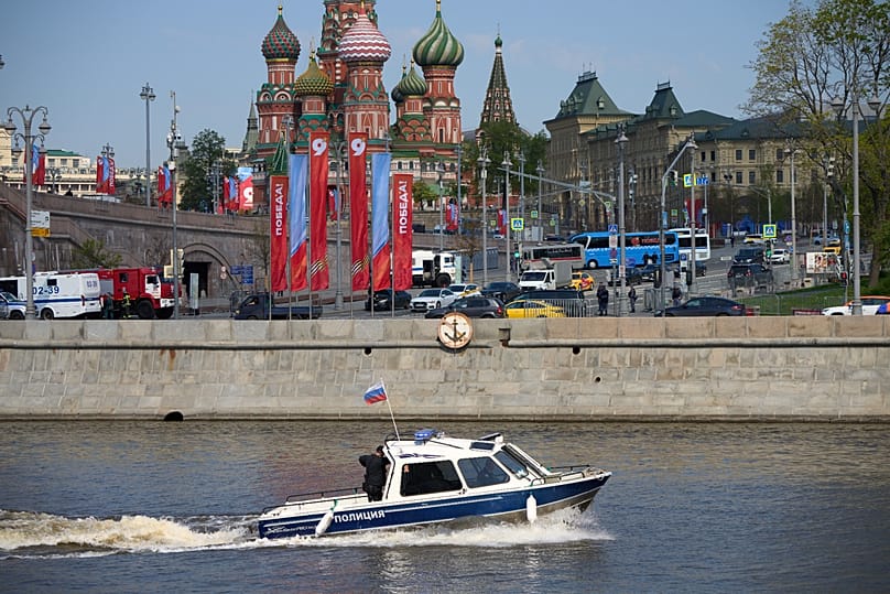 A police boat patrol the waters of the Moskva River near Red Square during the Victory Day military parade rehearsal in Moscow, Russia, Thursday, May 7, 2026,