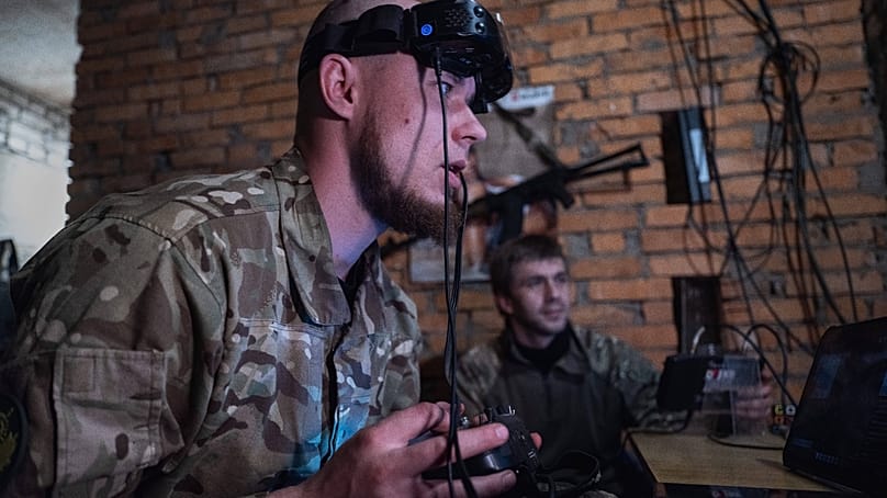 Servicemen control FPV drones from a shelter in Druzhkivka, Donetsk region, Ukraine, Thursday, May 7, 2026.
