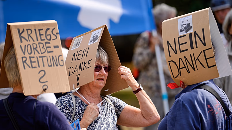 Demonstrators protest against what they believe to be preparations for war, outside the North Rhine-Westphalia State Parliament, 4 September 2025