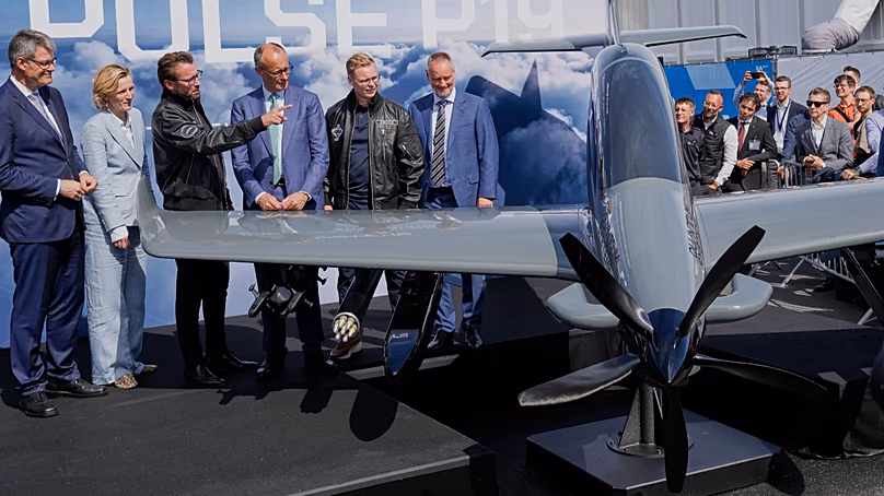 German Chancellor Friedrich Merz looks at a Pulse P 16 drone at the International Aerospace Exhibition (ILA ) at the airport fairground in Berlin, June 10, 2026.