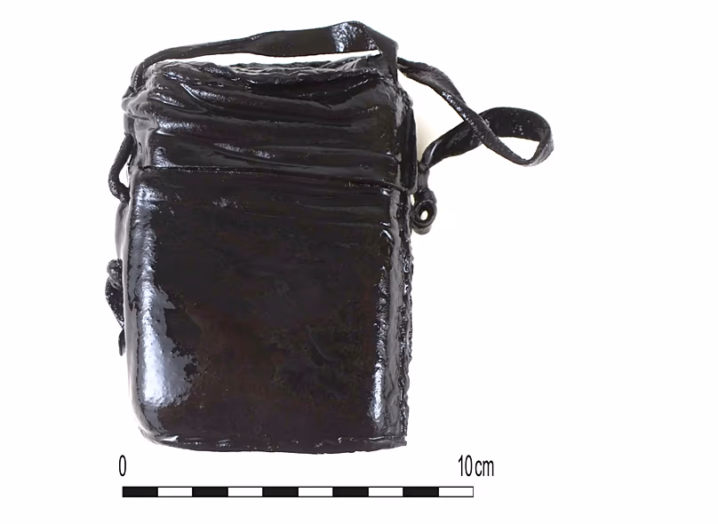 Remarkably, even the pouch that held the little book is well preserved and could almost be from the present day. It features a lily pattern.