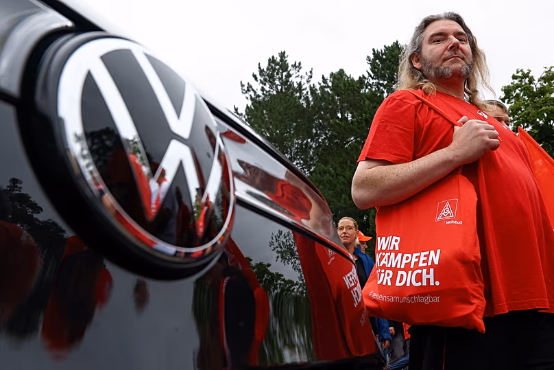 Workers stage a protest outside the Volkswagen plant in Zwickau, 9 July, 2026
