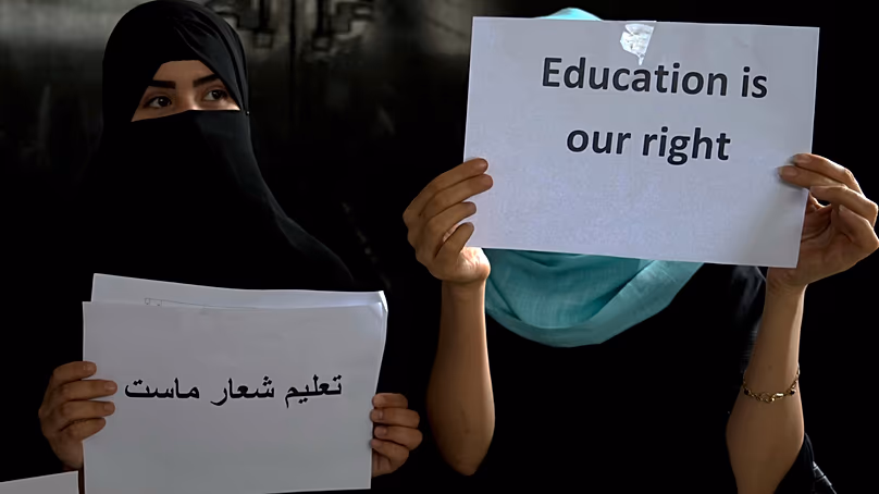 Afghan girls hold an illegal protest to demand the right to education in a private home in Kabul, Afghanistan, 2 August, 2022.