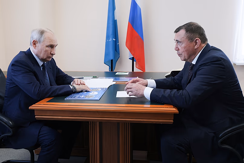 Vladimir Putin listens to Sakhalin Region Governor Valery Limarenko in Kurilsk on Iturup, the largest of the disputed Kuril Islands, on Thursday, Aug. 13, 2026