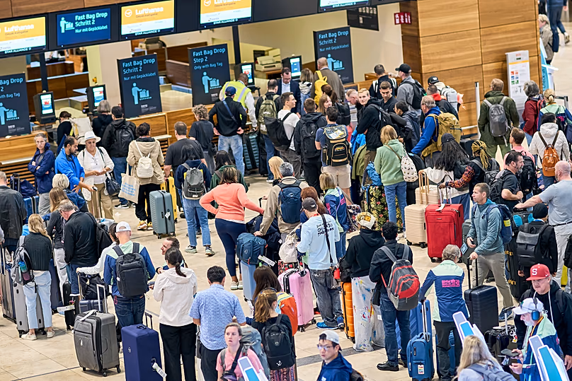 Passengers at check-in counters in Terminal 1 at Berlin Brandenburg Airport, 22 September, 2025