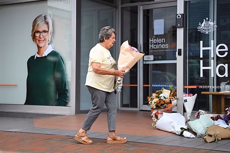A woman delivers flowers at the electoral office of Helen Haines in Wangaratta, 20 October, 2026