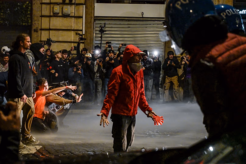People attend a protest in Rome, Italy, Saturday, Oct. 24, 2026. (Valentina Stefanelli/LaPresse via AP)